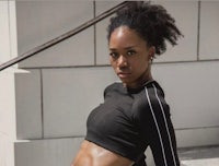 a black woman is posing for a photo