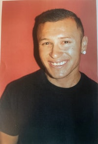 a photo of a man smiling for the camera